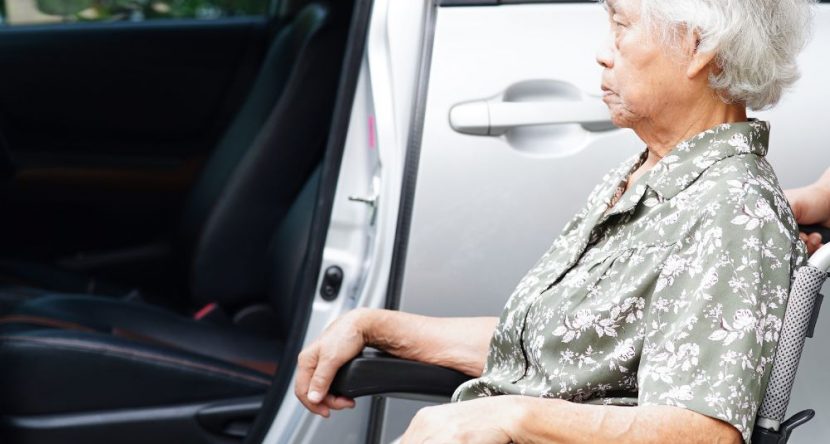 Caregiver help Asian elderly woman disability patient get in her car, medical concept – wheel of hope Caregiver help Asian elderly woman disability patient get in her car, medical concept - wheel of hope
